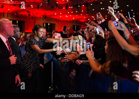 US First Lady Michelle Obama greets audience members after delivering remarks at the National Council of La Raza annual conference July 23, 2013 in New Orleans, Louisiana. Stock Photo
