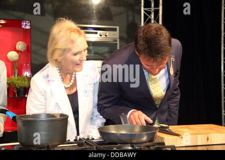 TV cook, Mary Berry (left) with Lord Sebastian Coe in the cookery theatre, Chatsworth Country Fair, Derbyshire, UK Stock Photo