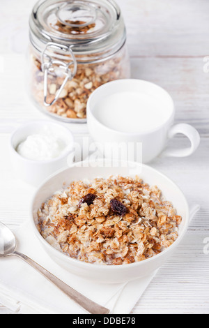 Muesli granola with raisin in wooden bowl Stock Photo