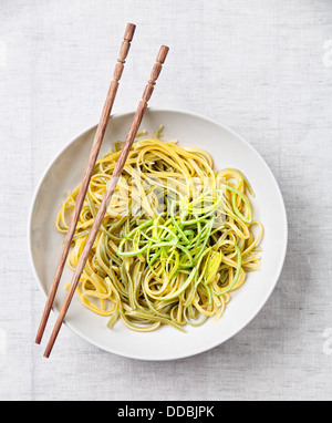 Asian noodles with leek on textile background Stock Photo
