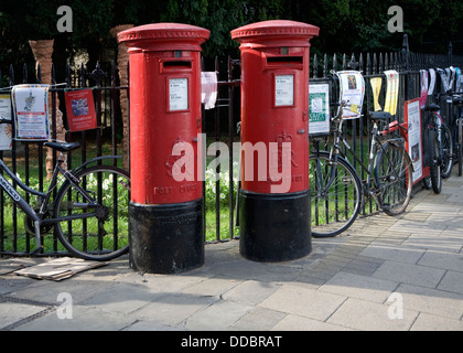 Two traditional red pillar post boxes Cambridge England Stock Photo