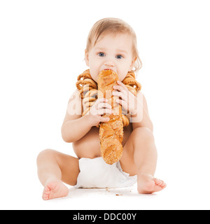 cute todler eating long bread Stock Photo