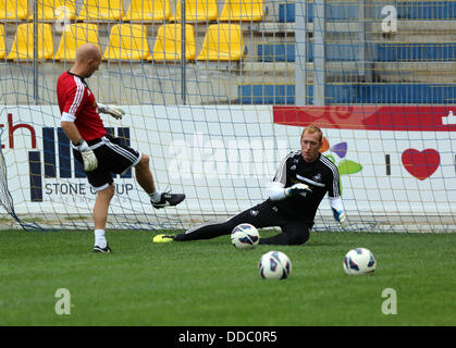 Ploiesti, Romania. Wednesday 28 August 2013  Pictured: Adrian Tucker and goalkeeper Gerhard Tremmel training at Petrolul Ploiesti Stadium.   Re: Swansea City FC arrive to Romania for a press conference and training session, a day before their UEFA Europa League, play off round, 2nd leg, against Petrolul Ploiesti in Romania. © D Legakis/Alamy Live News Stock Photo