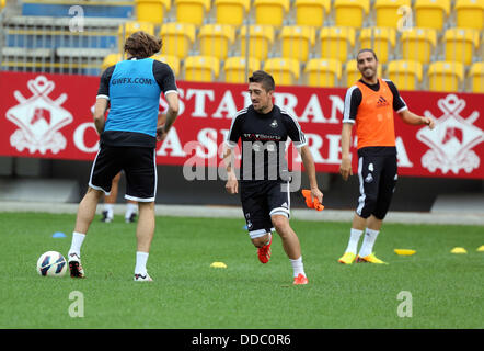 Ploiesti, Romania. Wednesday 28 August 2013  Pictured L-R: Michu, Pablo Hernandez and Chico Flores training at Petrolul Ploiesti Stadium.   Re: Swansea City FC arrive to Romania for a press conference and training session, a day before their UEFA Europa League, play off round, 2nd leg, against Petrolul Ploiesti in Romania. © D Legakis/Alamy Live News Stock Photo