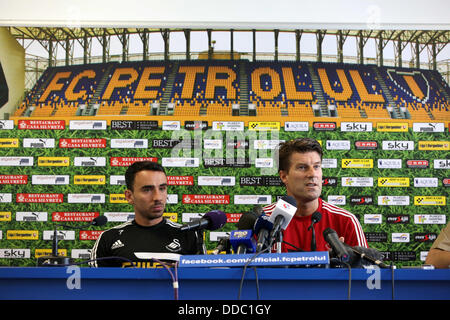 Ploiesti, Romania. Wednesday 28 August 2013  Pictured L-R: Leon Britton and manager Michael Laudrup during a press conference at Petrolul Ploiesti Stadium.   Re: Swansea City FC arrive to Romania for a press conference and training session, a day before their UEFA Europa League, play off round, 2nd leg, against Petrolul Ploiesti in Romania. © D Legakis/Alamy Live News Stock Photo