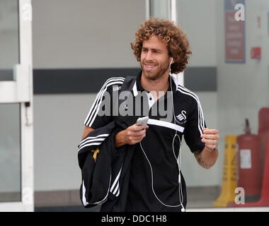 Cardiff, UK. Wednesday 28 August 2013  Pictured: Jose Canas at Cardiff Airport.  Re: Swansea City FC players and staff en route for their UEFA Europa League, play off round, 2nd leg, against Petrolul Ploiesti in Romania. © D Legakis/Alamy Live News Stock Photo