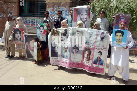 Pakistan. 30th Aug, 2013. Relatives of missing persons are protesting against missing and kidnapping of their beloved and demanding for their release on the occasion of universal day for missing persons during a demonstration arranged by Voice for Baloch Missing Persons at Quetta press club on Friday, August 30, 2013. Credit:  Asianet-Pakistan/Alamy Live News
