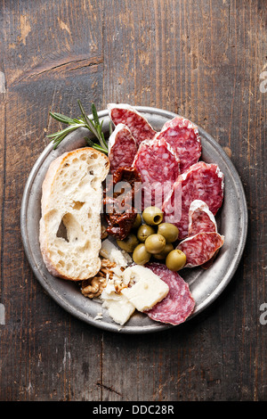 Italian salami with olives and ciabatta Stock Photo