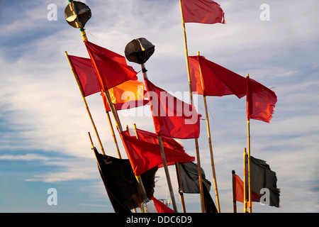 Colorful flags of a fishing boat in the harbor of Listed on Bornholm, Denmark Stock Photo