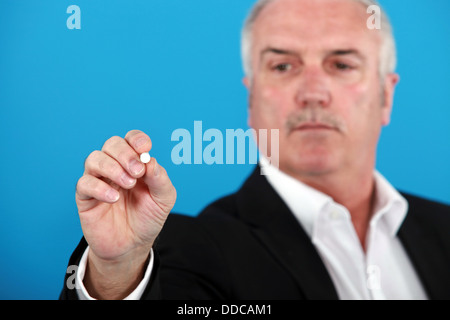 Business holding and pen to the camera Stock Photo