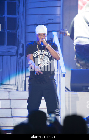 SACRAMENTO, CA - AUGUST 28: Rapper Clifford Joseph Harris, Jr. aka T.I. performs in concert as part of America's Most Wanted Tour at Sleep Train Arena on August 28, 2013 in Sacramento, California. Stock Photo