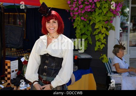 Pretty young woman with red hair dressed up for the steampunk festival in Coldwater Ontario Stock Photo