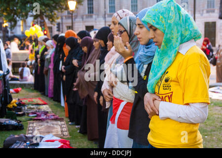 Downing Street, London, UK. 30th Aug, 2013.  Women pray as Egyptians protest against the military regime that removed their elected President Morsi. Credit:  Paul Davey/Alamy Live News Stock Photo
