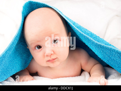 Cute baby lying on towel Stock Photo