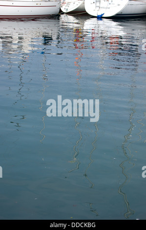 Reflecting yacht masts in Lerwick harbour, Shetland Stock Photo
