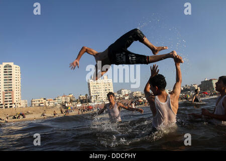Gaza City, Gaza Strip, Palestinian Territory. 30th Aug, 2013. Palestinians play in the sea at Gaza beach during the weekend western Gaza City on Aug 30, 2013 © Mohammed Asad/APA Images/ZUMAPRESS.com/Alamy Live News Stock Photo