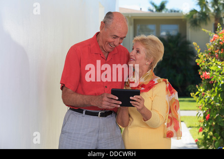 Senior couple using a digital tablet Stock Photo