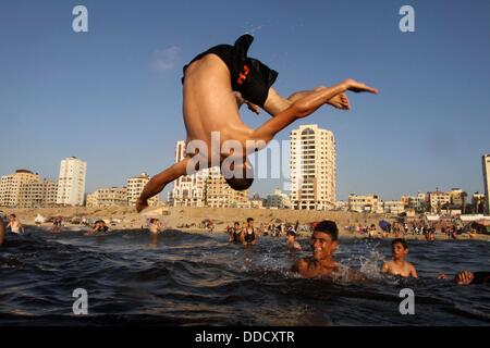 Gaza City, Gaza Strip. 30th Aug, 2013. Palestinians play in the sea at Gaza beach, finding a way to beat the heat as the weekend arrives. © Mohammed Asad/APA Images/ZUMAPRESS.com/Alamy Live News Stock Photo