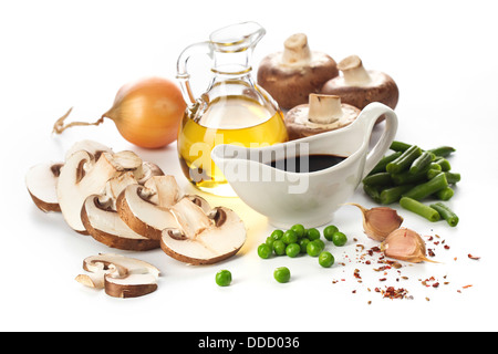 Fresh mushrooms and vegetables ingredients on white background Stock Photo