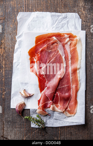 Ham slices on wooden background Stock Photo