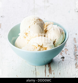 Vanilla ice cream in blue bowl Stock Photo