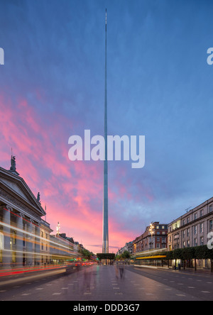 architectural portrait twilight image of the Spire, Dublin Ireland with the GPO O'Connell Street and busses passing Architecture Stock Photo