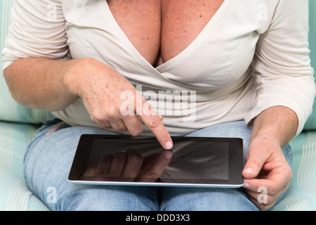 Woman in jeans using a Table PC Stock Photo