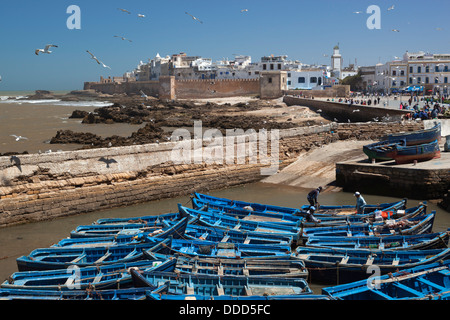 View over the fishing harbour to the ramparts and medina Stock Photo
