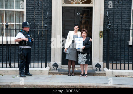 London, UK. 31st Aug, 2013.  Secretary of the Charles Bronson Appeal Fund, Lorraine Etherington (L), and  Charles Bronson’s cousin, Lorraine Salvage (R), stand outside 10 Downing street with a petition containing10,000 names calling for his release from prison. Credit:  Andy Thornley/Alamy Live News Stock Photo