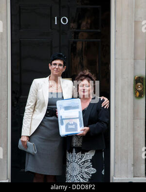 London, UK. 31st Aug, 2013.  Secretary of the Charles Bronson Appeal Fund, Lorraine Etherington (L), and  Charles Bronson’s cousin, Lorraine Salvage (R), stand outside 10 Downing street with a petition containing10,000 names calling for his release from prison. Credit:  Andy Thornley/Alamy Live News Stock Photo