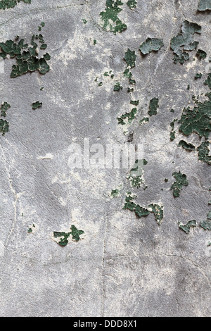 Old plaster with remnants of paint on the wall Stock Photo