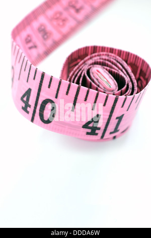 Pink tape measure isolated on white background Stock Photo