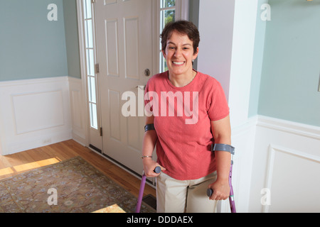 Woman with cerebral palsy smiling in her home Stock Photo