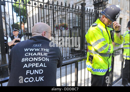 Downing Street, London, UK. 31st August 2013. Supporters of Charles Bronson outside Downing Street as a petition is handed in to have him released after 40 years in jail Credit:  Matthew Chattle/Alamy Live News Stock Photo