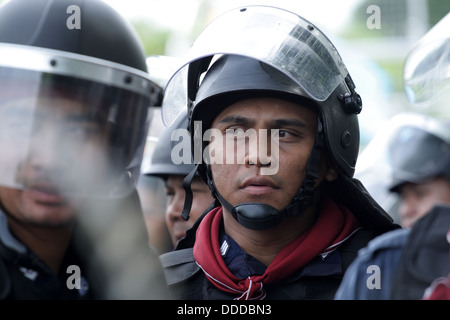 Riot policeman standing guard near Parliament of Thailand Stock Photo