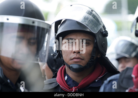 Riot policeman standing guard near Parliament of Thailand Stock Photo