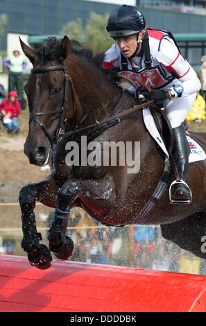 Malmo, Sweden. 31st Aug, 2013. British eventer Kristina Cook rides on his horse Miners Frolic during the cross country competition of the European Eventing Championships in Malmo, Sweden, 31 August 2013. Photo: JOCHEN LUEBKE/dpa/Alamy Live News Stock Photo