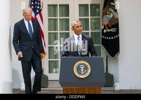 Washington DC, USA. 31st Aug, 2013. United States President Barack Obama, joined by Vice President Joe Biden, delivers a statement on Syria in the Rose Garden of the White House in Washington, D.C. on August 31, 2013. Credit: Kristoffer Tripplaar / Pool via CNP Credit:  dpa picture alliance/Alamy Live News Stock Photo