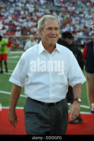 Aug. 30, 2013 - University Park, TX, USA - August 30, 2013: Former United States President George Bush Jr. flipping the coin toss at the middle of the field during the game between the Texas Tech Red Raiders and the Southern Methodist Mustangs at Gerald J. Ford Stadium in University Park, Texas Tech wins against SMU, 41-23. Stock Photo