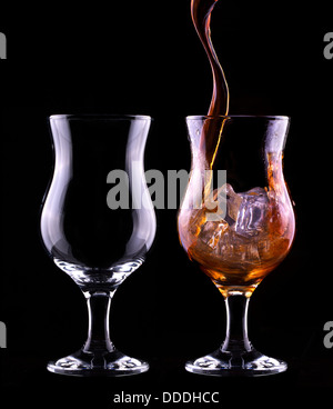 Fresh cola drink background with splash isolated on a black Stock Photo