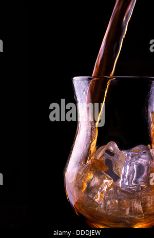 Fresh cola drink background with splash isolated on a black Stock Photo