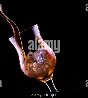 Fresh cola drink background with splash isolated on a black Stock Photo