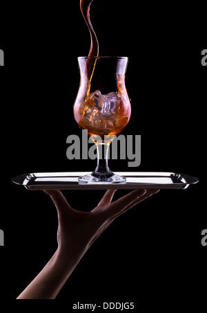 Fresh cola drink background with splash isolated on a black Stock Photo