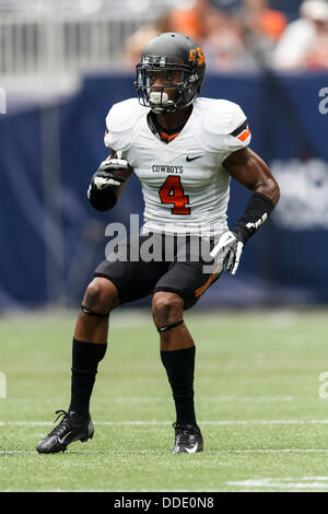 Aug. 31, 2013 - Houston, Texas, United States of America - August 31, 2103: Oklahoma State Cowboys cornerback Justin Gilbert (4) during the Advocare Texas Kickoff NCAA football game between the Mississippi State Bulldogs and the Oklahoma State Cowboys at Reliant Stadium in Houston, TX. Stock Photo