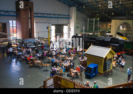 View over cafe & steam trains on display at the National Railway Museum in the city of York North Yorkshire England UK Stock Photo
