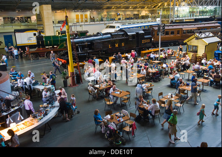View over cafe & steam trains on display at the National Railway Museum in the city of York North Yorkshire England UK Stock Photo