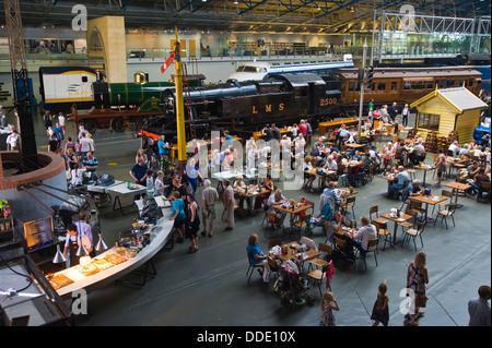 View over cafe & steam trains on display at the National Railway Museum in the city of York North Yorkshire England UK Stock Photo