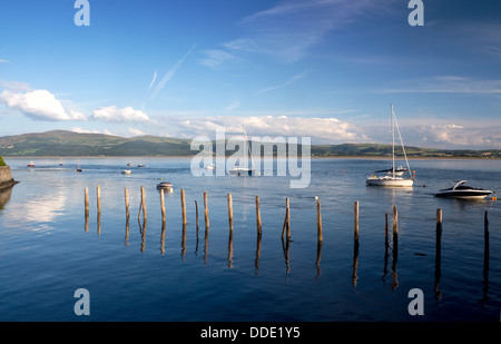 Aberdovey Aberdyfi Boats in harbour estuary river with mooring posts in foreground Gwynedd Mid Wales UK Stock Photo