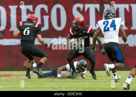 Nov. 2, 2013 - San Diego, CA, United States of America - San Diego State  Aztecs offensive linesman Daniel Brunskill (89) assists San Diego State  Aztecs running back Adam Muema (4) in