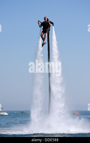 Jetlev, a personal flying machine flying based on a water-propelled jetpack near Marbella, Andalusia, Spain. Stock Photo